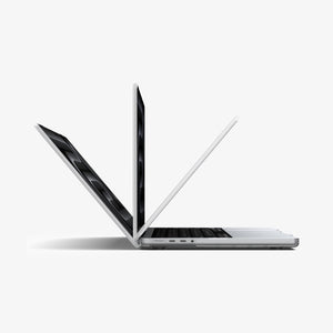 Spigen MacBook Pro 14-inch Air Skin in Frost Clear showing three MacBook units opened at different angles to demonstrate the case allows full range of motion beyond 90 degrees