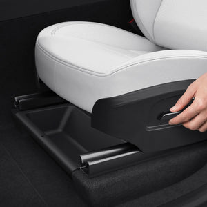 Spigen Tesla Model Y Juniper underseat organizer sliding into position below the front seat