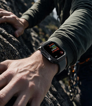 Apple Watch Series 12 (46mm) Case Rugged Armor in Matte Black showing the rugged protective case worn during an outdoor climbing activity