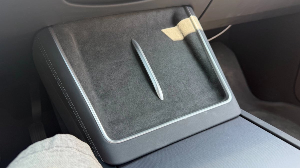 Tesla Model Y L fan-cooled wireless phone charger retrofit installed in a refreshed Model Y center console