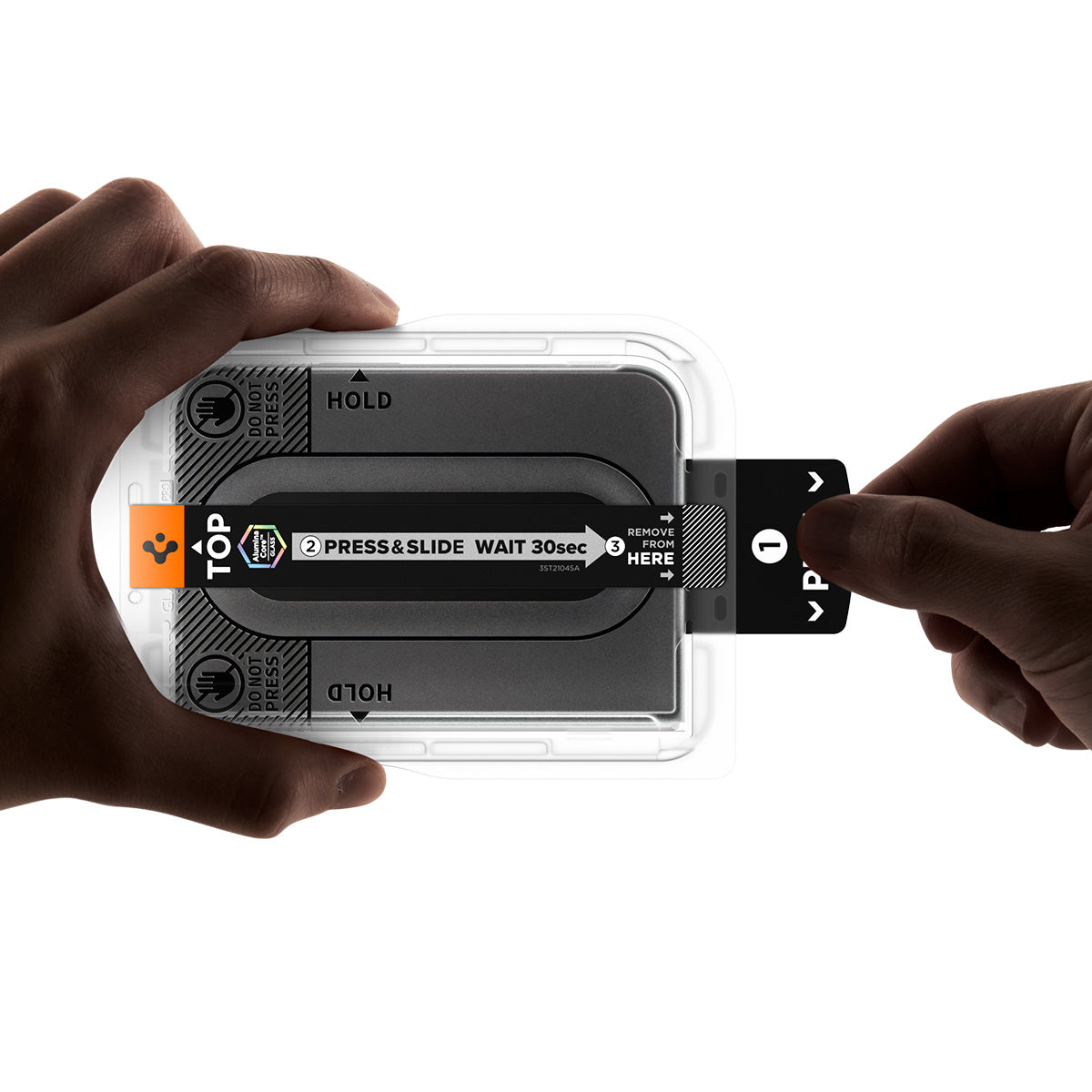 iPhone Duo GLAS.tR EZ Fit Pro | Privacy showing hands holding the installation tray while pulling the tab to begin the application process.