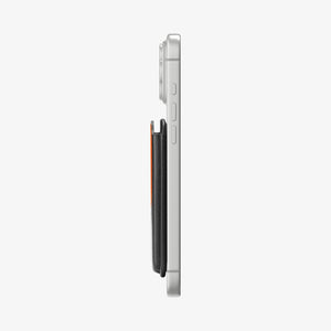 Side profile of the Spigen Valentinus MagFit+ wallet attached to an iPhone