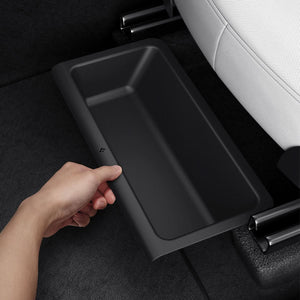 Spigen Model Y Juniper underseat storage box being pulled forward for access
