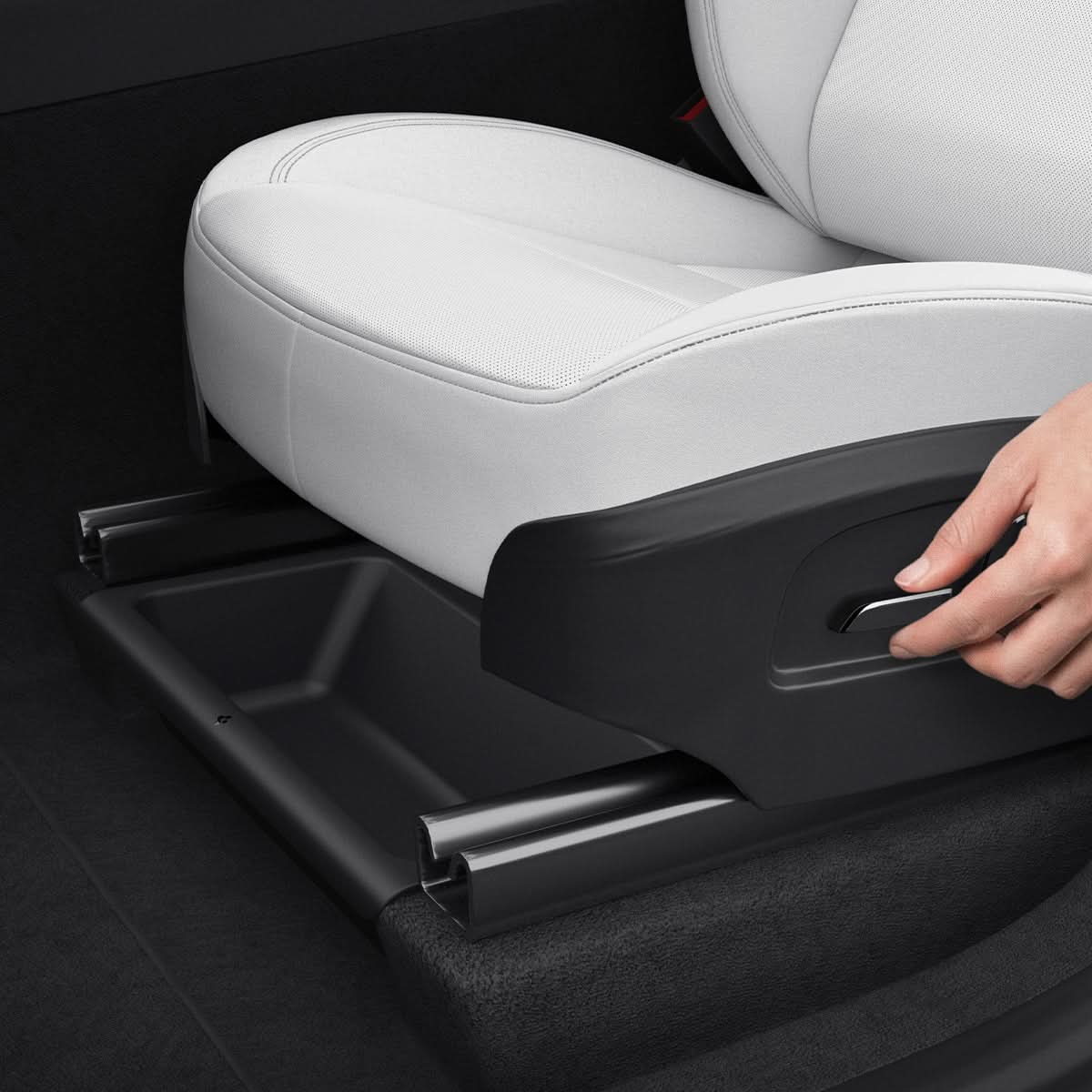 Spigen Tesla Model Y Juniper underseat organizer sliding into position below the front seat
