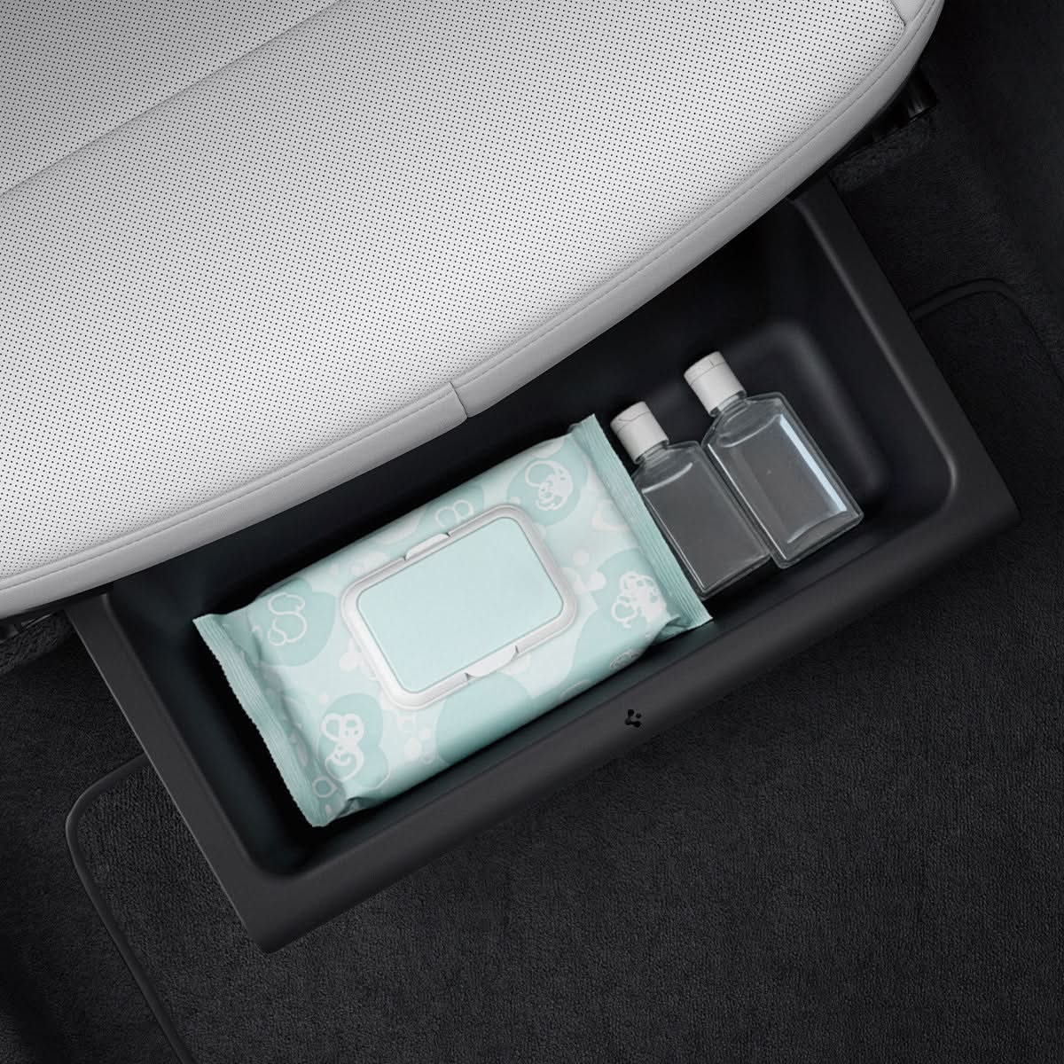 Spigen underseat organizer holding a bottle below a Tesla Model Y Juniper seat