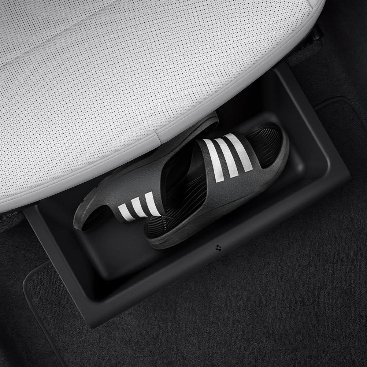Spigen Model Y Juniper underseat storage box holding compact shoes