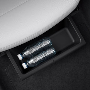 Spigen underseat organizer holding a reusable water bottle in a Model Y Juniper