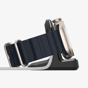 Apple Watch placed sideways on the Spigen Rugged Armor charging stand