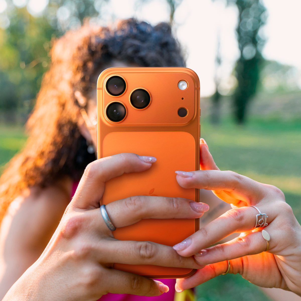 Spigen iPhone 17 Pro Lens Protector – GLAS.tR EZ Fit Optik Pro XL [1 Pack] - Cosmic Orange - in-hand use view