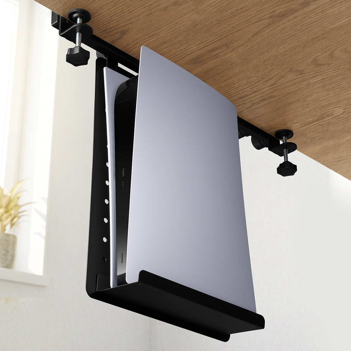 Under-desk LD406 shelf holding a laptop or tablet vertically