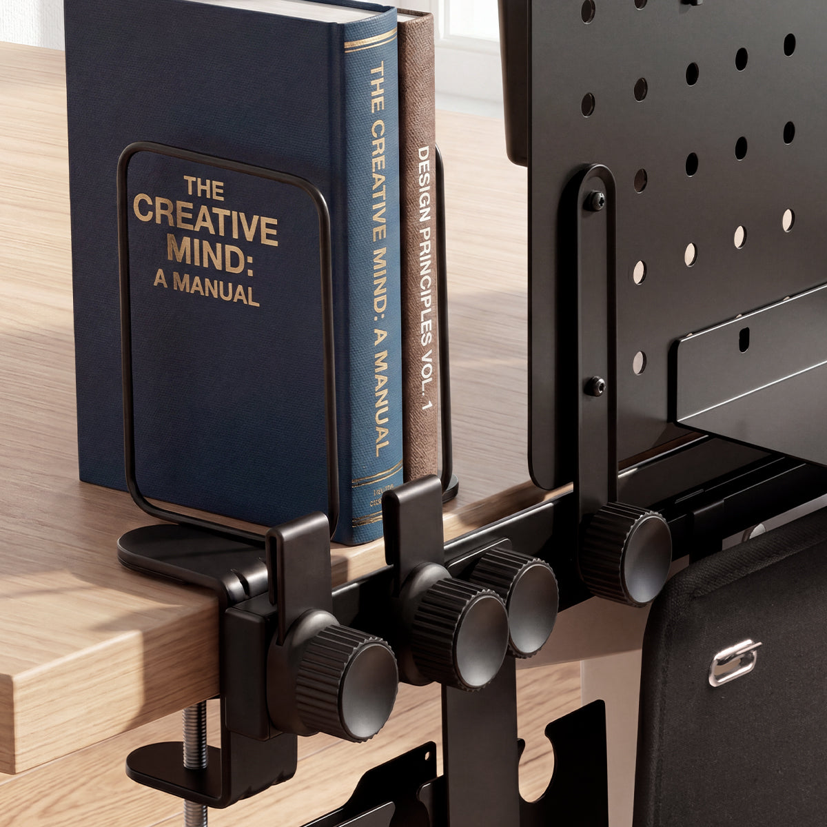 LD406 bookends and adjustable rail knobs organizing books at the desk edge