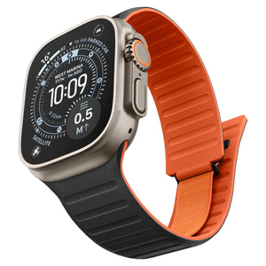 Angled front view of the black and orange Apple Watch magnetic band