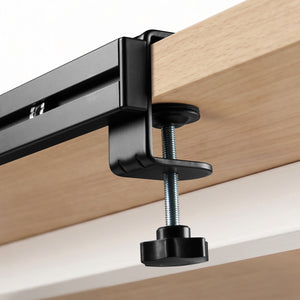 Close view of the Spigen LD406 no-drill clamp secured to a desktop edge