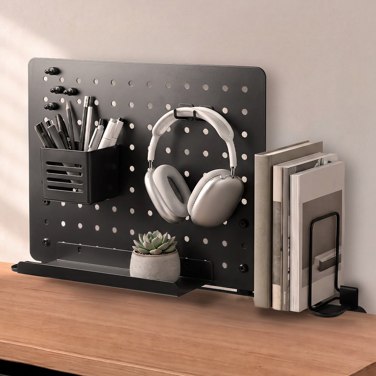 LD406 pegboard arranging headphones, stationery, books and a small plant