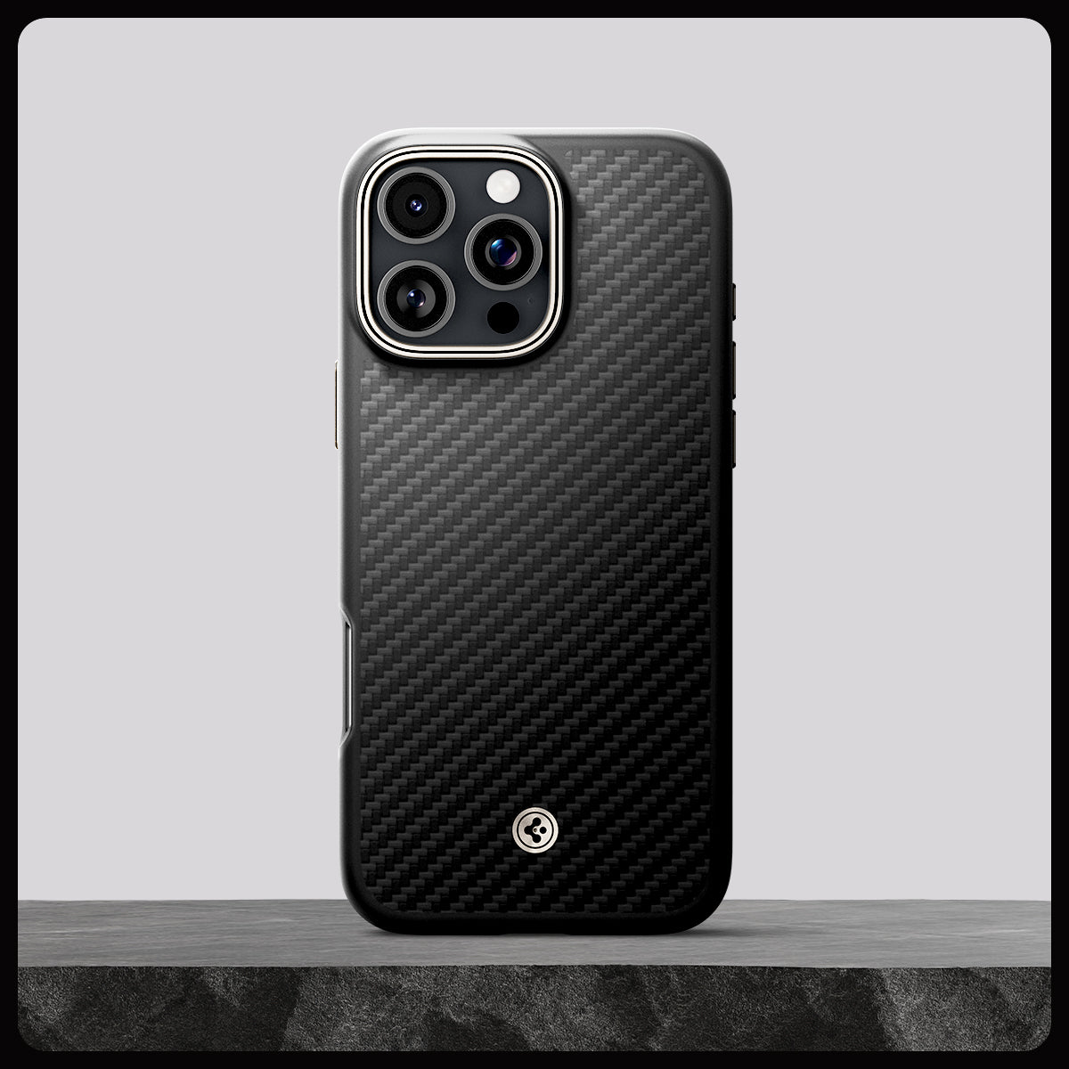 Spigen Enzo Aramid MagFit case in Black Natural for iPhone 16 Pro - product on stone display