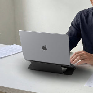 AMP11116 - Slim Fold Laptop Stand | LD201-S7 showing back view of person using iPad propped up on laptop stand