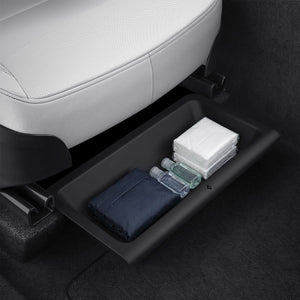 Spigen TO222J black underseat organizer with assorted compact travel items